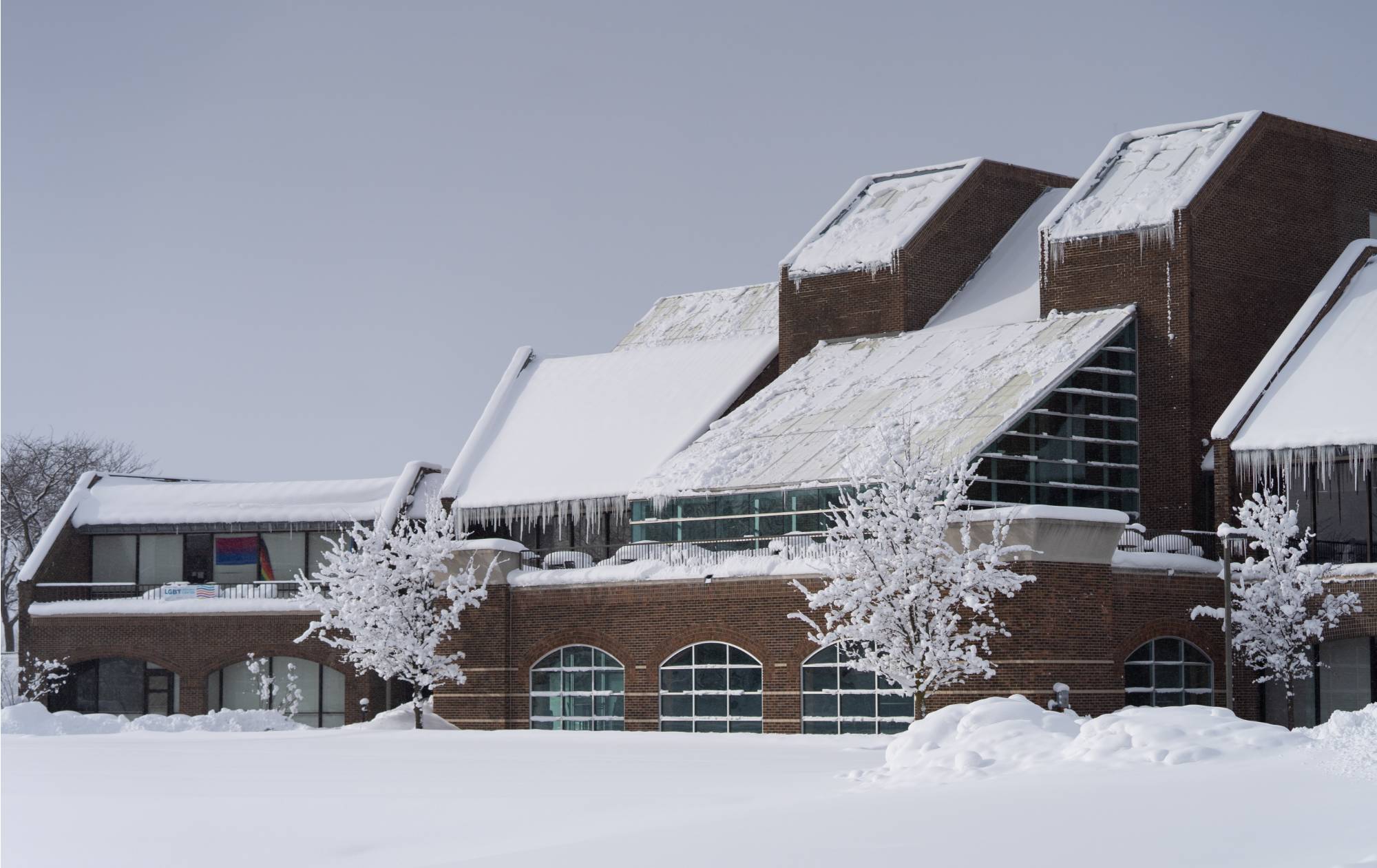 The Kirkhof Center on GVSU's Allendale Campus in the winter with snow on the ground